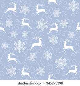 Winter seamless pattern with white reindeers and snowflakes on blue background.