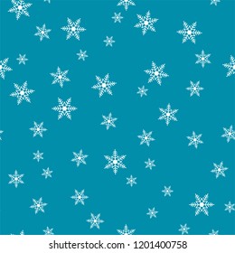 Winter seamless pattern with white snowflakes of different sizes on a blue background. Vector.