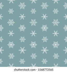 Winter seamless pattern with white snowflakes on blue background. New Year backdrop. Vector flat symmetric Christmas ornament for fabric, textile, wrapping paper, card, invitation, wallpaper