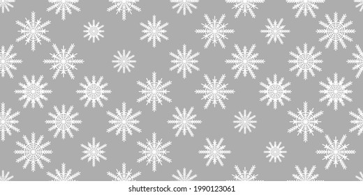 Winter seamless pattern with white snowflakes on grey background. Vector illustration for fabric, textile wallpaper, posters, gift wrapping paper. Christmas vector illustration. Falling snow.