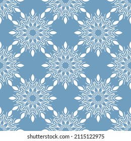 Winter seamless pattern with white snowflakes on blue background. Vector illustration for fabric, textile wallpaper, posters, gift wrapping paper. Christmas vector illustration.