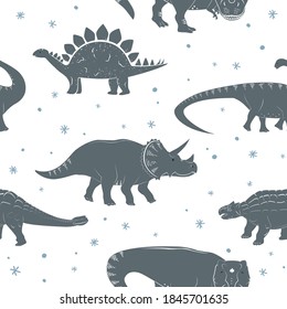Winter seamless vector pattern with cute young dinosaurs and hand drawn doodle snowflakes. Xmas kids background