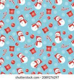 Winter seamless vector pattern on blue background with traditional Christmas symbols and decorative elements. New year background with cute snowmans, candies, gifts, christmas toys and snowflakes