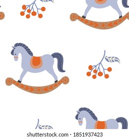 Winter season seamless pattern for fabric, textile, wrapping paper. Cute vector toy horses Vector illustration.