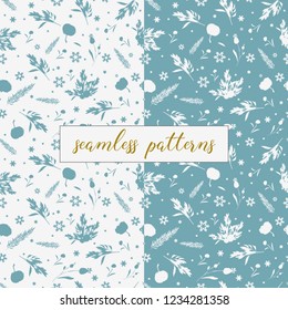 Winter set of 2 blue and white seamless patterns for wrapping paper. Patterns with snowflakes and silhouettes of botanica