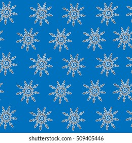 Winter snowflake seamless pattern on the blue background. Christmas seamless wallpaper. Can be used for printing on fabric, for wrapping paper and for the background of the site.