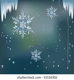 winter snowflakes and ice on a window pane