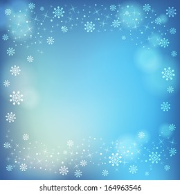 Winter snowflakes and soft highlights background. Place for text.