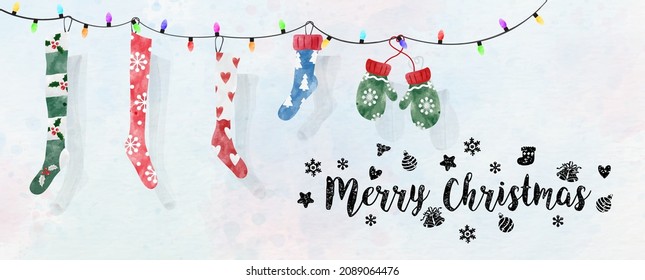 Winter socks and gloves hanging with Christmas decoration lights, Merry Christmas letters on watercolor and white paper pattern background. Christmas greeting card in vector and watercolors style