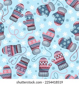 Winter theme seamless pattern with colorful mittens and snowflakes. Vector illustration.