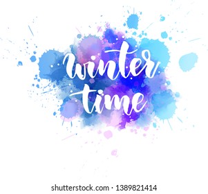 Winter time - handwritten modern calligraphy lettering message on watercolor paint splash. Season and holiday concept illustration.