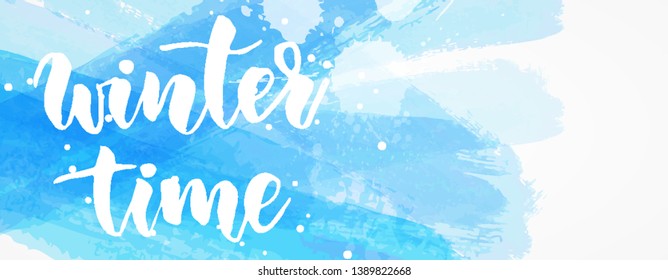 Winter time - handwritten modern calligraphy lettering message on paint brushed blue banner. Season and holiday concept illustration.