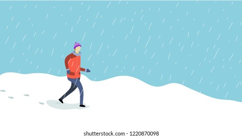 Winter time man walking snow falling. 