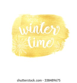 Winter time typographic poster. Vector hand drawn phrase.  Ink painted lettering on gold watercolor background. 