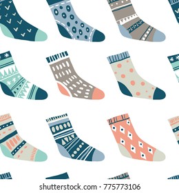 Winter vector seamless pattern with cute socks on white. Funny doodle socks with different patterns
