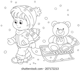 Winter walk. Child with a sled and toy bear