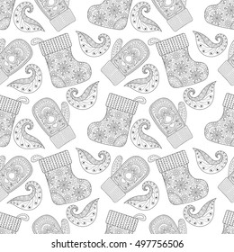 Winter warm knitted mittens, socks seamless pattern in zentangle style. Hand drawn Christmas decorative elements for adult coloring book. Vector illustration for New Year 2017 greeting cards, posters.