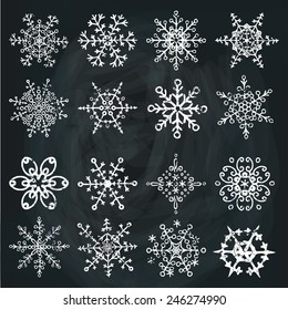 Winter white Snowflake big set.Decor elements.Vector doodles. Vintage christmas,New year Chalkboard background,icon,sign.