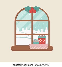 Winter window with christmas presents on the sill and a branch of mistletoe