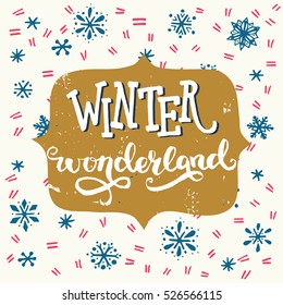 Winter Wonderland inscription. Hand lettering holiday saying with snowflakes on the background. Great design elements for Xmas invitation or greeting card, flyer, print and holiday poster.