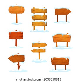 Winter wooden signs, cartoon signboards with snow and icicles, boards on wood poles. Vector arrows or road pointers. Blank vintage plank panels for ui design, game menu or pub entrance