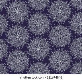 Winter wrapping paper design with white rosettes - snowflakes on blue background