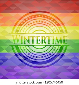 Wintertime emblem on mosaic background with the colors of the LGBT flag