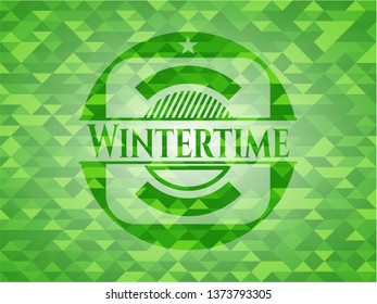 Wintertime green emblem with mosaic background