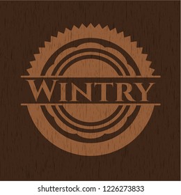Wintry badge with wooden background