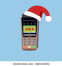 Wireless payment terminal for goods in a Santa Claus hat, gifts for the new year and Christmas sale