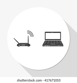 Wireless router connected to laptop.