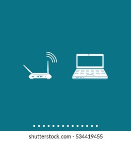 Wireless router connected to laptop.