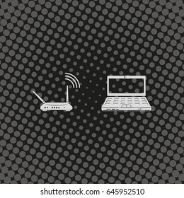 Wireless router connected to laptop.