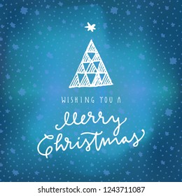 Wishing You A Merry Christmas calligraphic greeting card on blue winter sky northern lights background with stars. Hand lettering, modern calligraphy. Merry Christmas design. Vector illustration