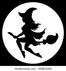 Witch flying against the full moon