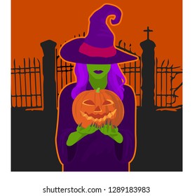 A witch holds a pumpkin in her hands in front of the cemetery