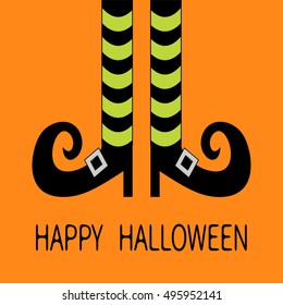 Witch legs with striped socks and shoes. Happy Halloween. Greeting card. Flat design. Orange baby background. Vector illustration