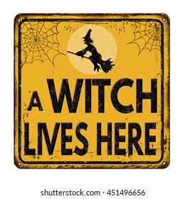 A witch lives here vintage rusty metal sign on a white background, vector illustration