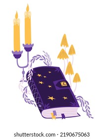 Witch magic book, mushrooms and candles