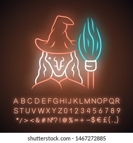 Witch neon light icon. Wicked sorceress, hag with broomstick. Halloween costume. Evil old woman in wizard hat and broom stick. Glowing sign with alphabet, numbers. Vector isolated illustration