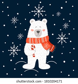 Wite bear with rear scarf and candy in snow for winter season.