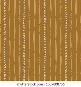 Withered stem stripes seamless vector pattern. Loose brush strokes of broken lines representing withered stems forming a strpe pattern in yllows and off-white.