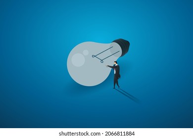 Without new ideas or lack of inspiration in work and business
A sad businessman standing in front of a light bulb that goes out.  isometric vector illustration.