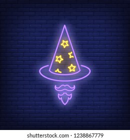 Wizard hat, beard and moustache neon sign. Carnival, party or advertisement design. Night bright neon sign, colorful billboard, light banner. Vector illustration in neon style.