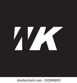 WK negative space letter logo black background