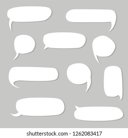 Wobbly speech bubbles, different shapes, horizontal and vertical, white with a drop shadow on a grey background. word boxes for childrens books or humour 