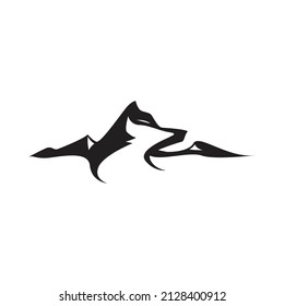 wolf silhouette among the mountains logo vector