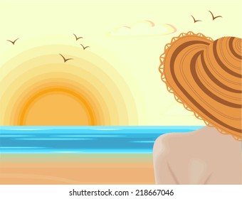 Woman admiring sunset in tranquility of the summer landscape