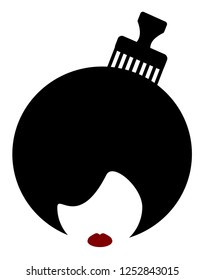 woman with afro and comb in hair