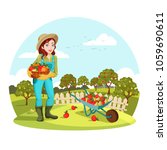 Woman agrarian gathering garden apples or picking pears. Female farmer or gardener standing near wheelbarrow with fruits. Organic and healthy food cultivation, natural nutrition and countryside theme